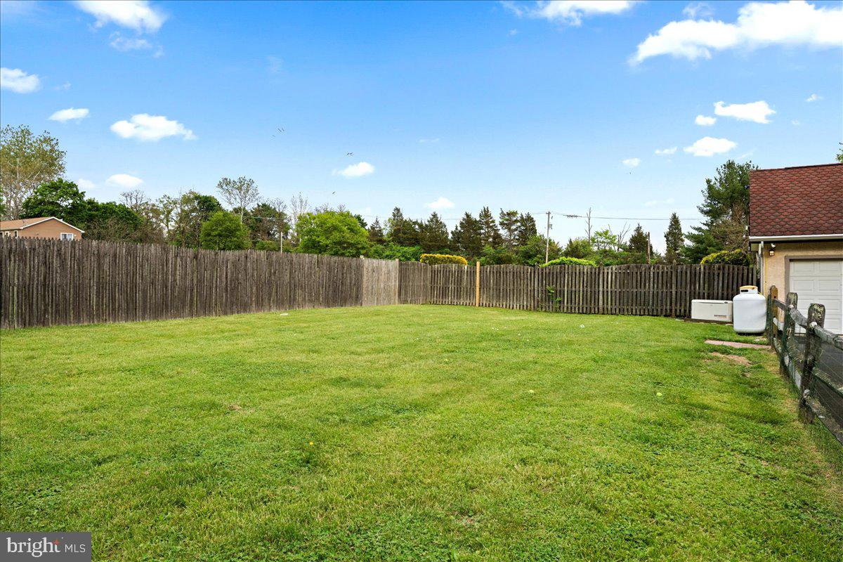 1121 Swamp Road Furlong, PA 18925 - Photo 40 of 50 Spacious green yard with a serene view.