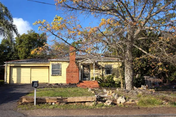 a front view of a house with garden