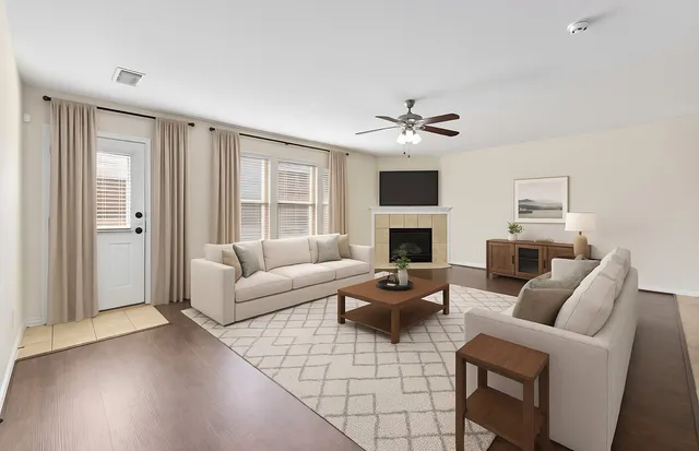 a view of an empty room with a fan