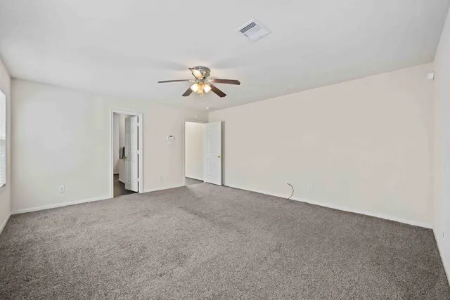 a bathroom with a toilet and bathtub