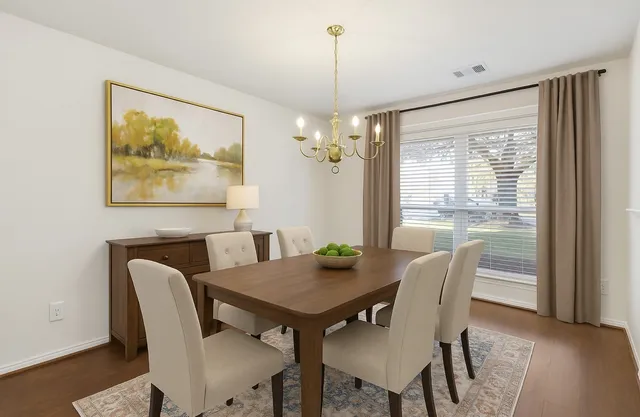 a kitchen with stainless steel appliances granite countertop a stove and a sink