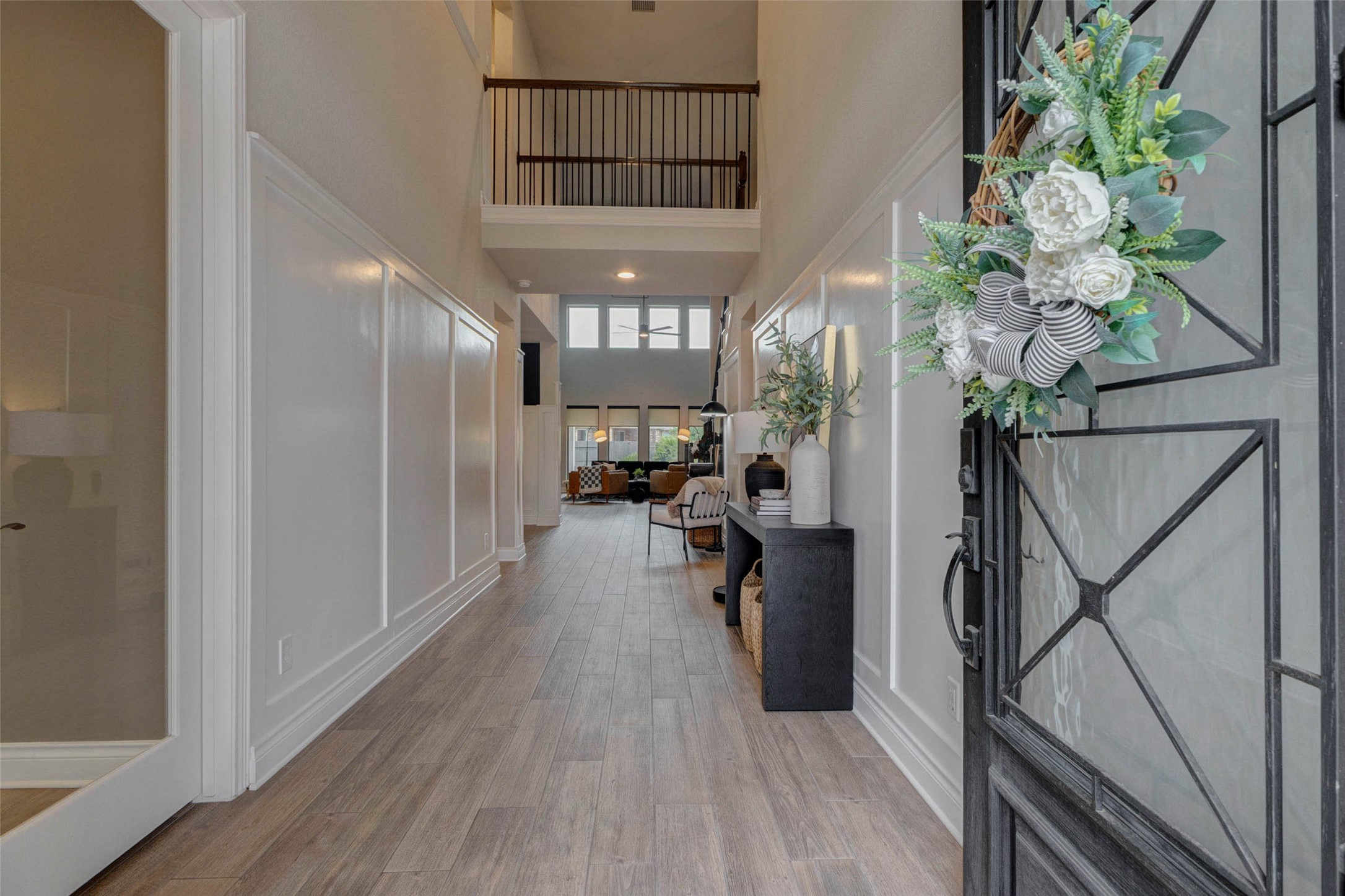 4303 Tupelo Leaf Court Manvel, TX 77578 - Photo 7 of 50 a view of a hallway with wooden floor