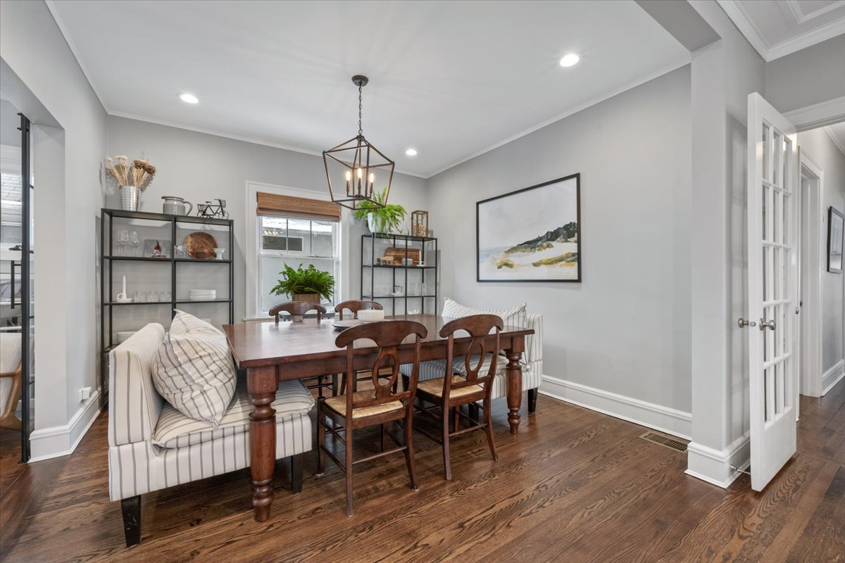 2215 Wesley Avenue Evanston, IL 60201 - Photo 15 of 52 a view of a dining room with furniture wooden floor and chandelier