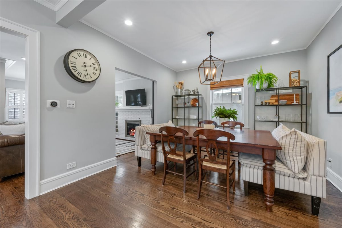2215 Wesley Avenue Evanston, IL 60201 - Photo 17 of 52 a dining room with furniture a rug and wooden floor