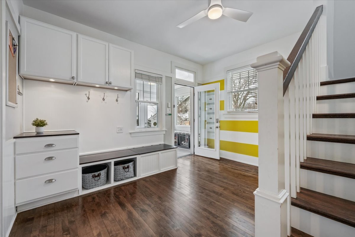 2215 Wesley Avenue Evanston, IL 60201 - Photo 24 of 52 a kitchen with stainless steel appliances white cabinets and wooden floors