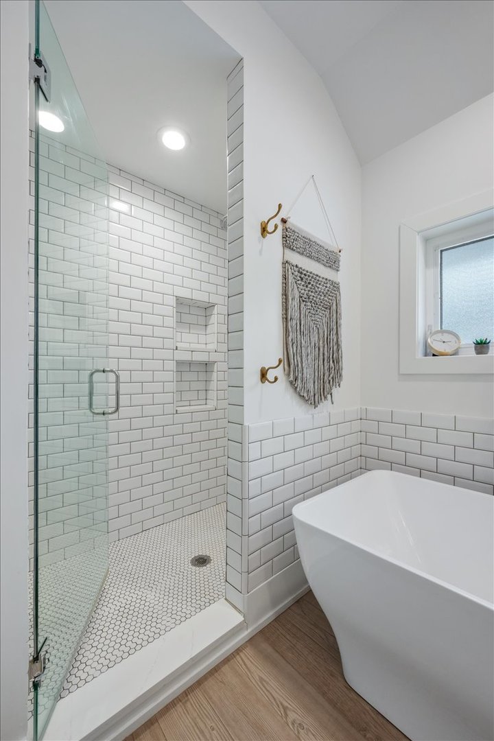 2215 Wesley Avenue Evanston, IL 60201 - Photo 31 of 52 a bathroom with a bathtub and shower