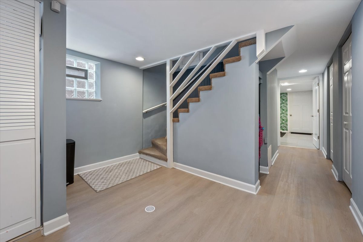 2215 Wesley Avenue Evanston, IL 60201 - Photo 33 of 52 a view of hallway with stairs and wooden floor