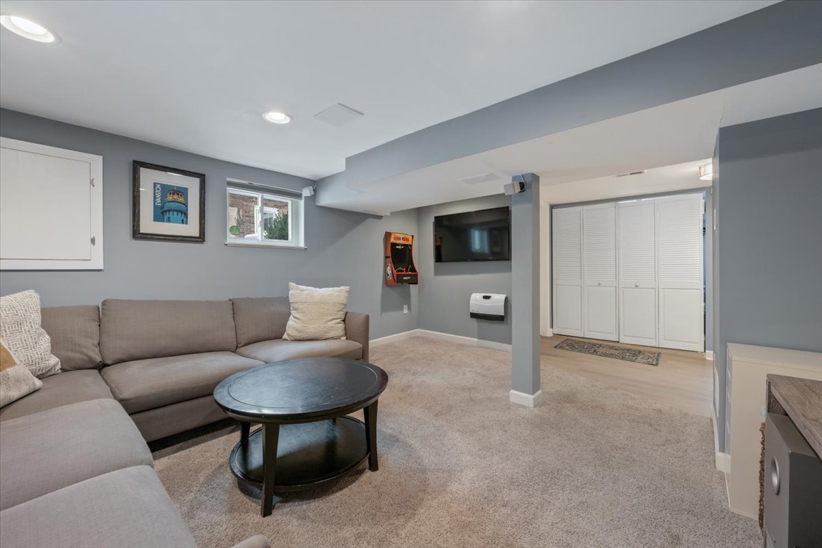 2215 Wesley Avenue Evanston, IL 60201 - Photo 35 of 52 a living room with furniture and a flat screen tv