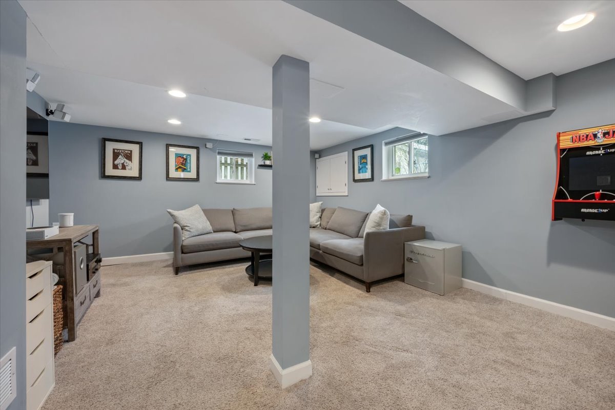 2215 Wesley Avenue Evanston, IL 60201 - Photo 37 of 52 a living room with furniture and a wall painting