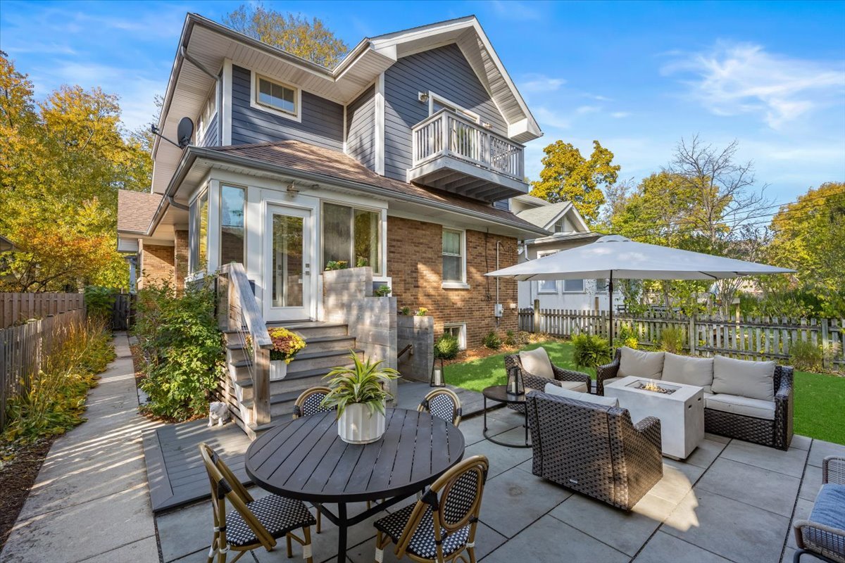 2215 Wesley Avenue Evanston, IL 60201 - Photo 47 of 52 a view of a patio with a table and chairs under an umbrella