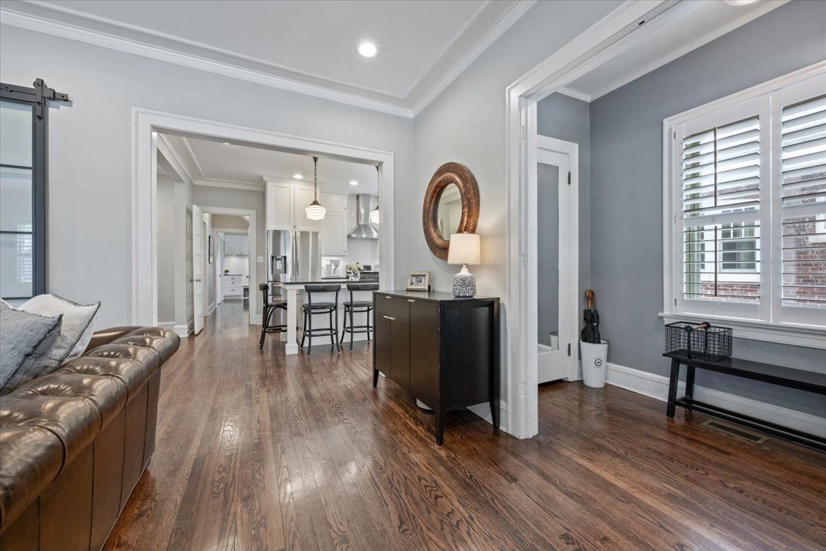 2215 Wesley Avenue Evanston, IL 60201 - Photo 7 of 52 a living room with furniture a wooden floor and a large window