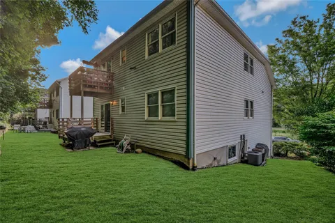 a view of a house with backyard