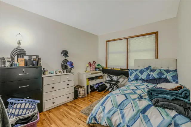 a bed room with a bed and a dresser