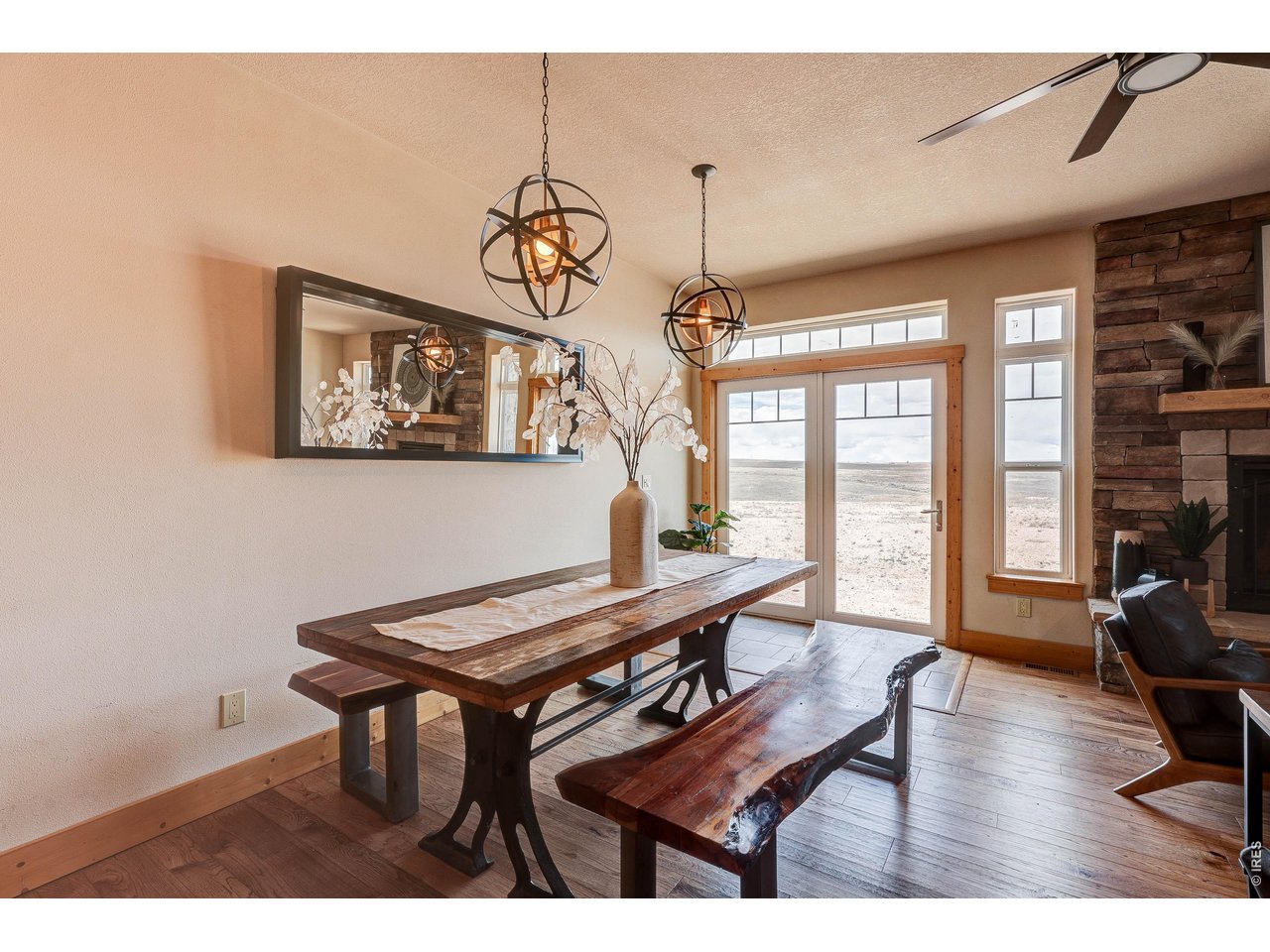 18298 Romar Ranch Road Carr, CO 80612 - Photo 29 of 49 a view of a dining room with furniture window and wooden floor