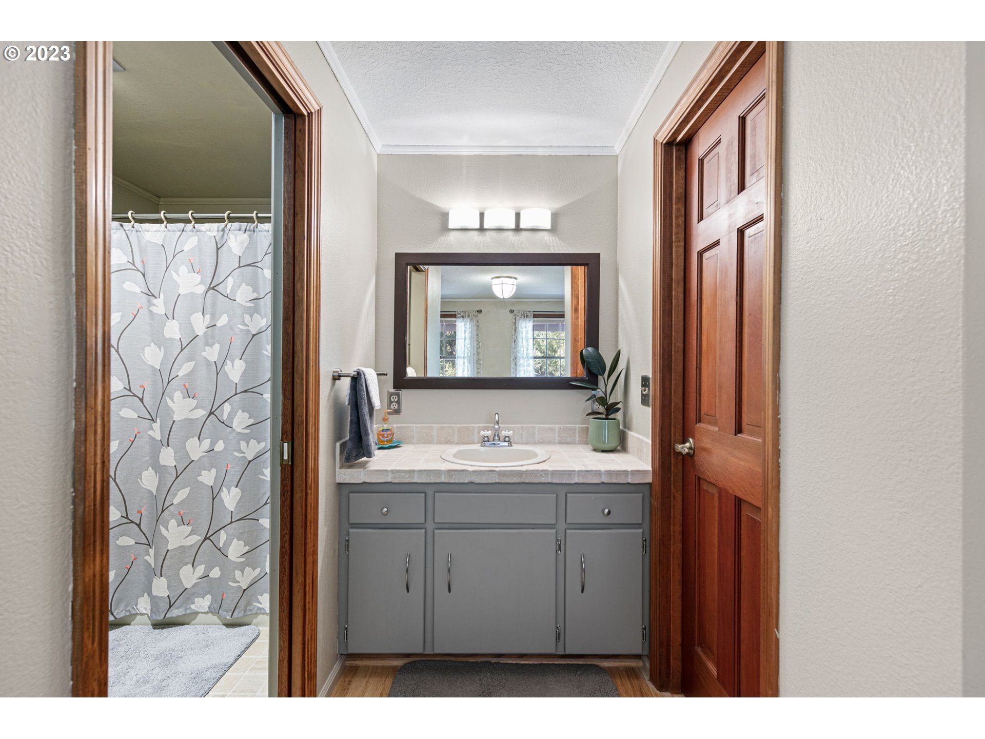 77914 Chisholm Trail Road Cottage Grove, OR 97424 - Photo 16 of 41 a bathroom with a sink and a mirror
