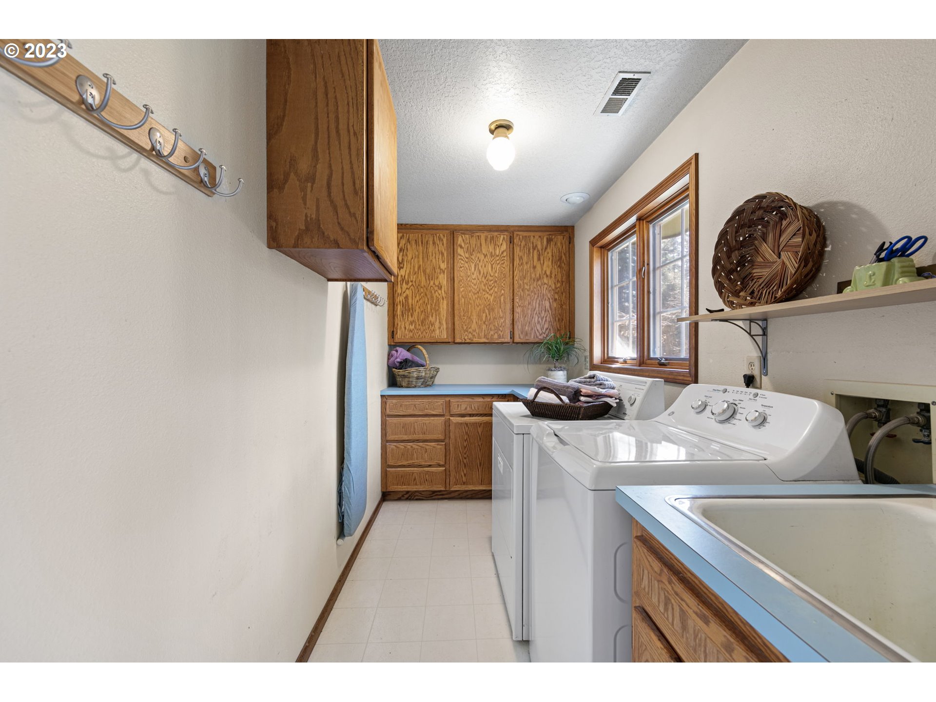77914 Chisholm Trail Road Cottage Grove, OR 97424 - Photo 25 of 41 a kitchen with a sink a stove and cabinets