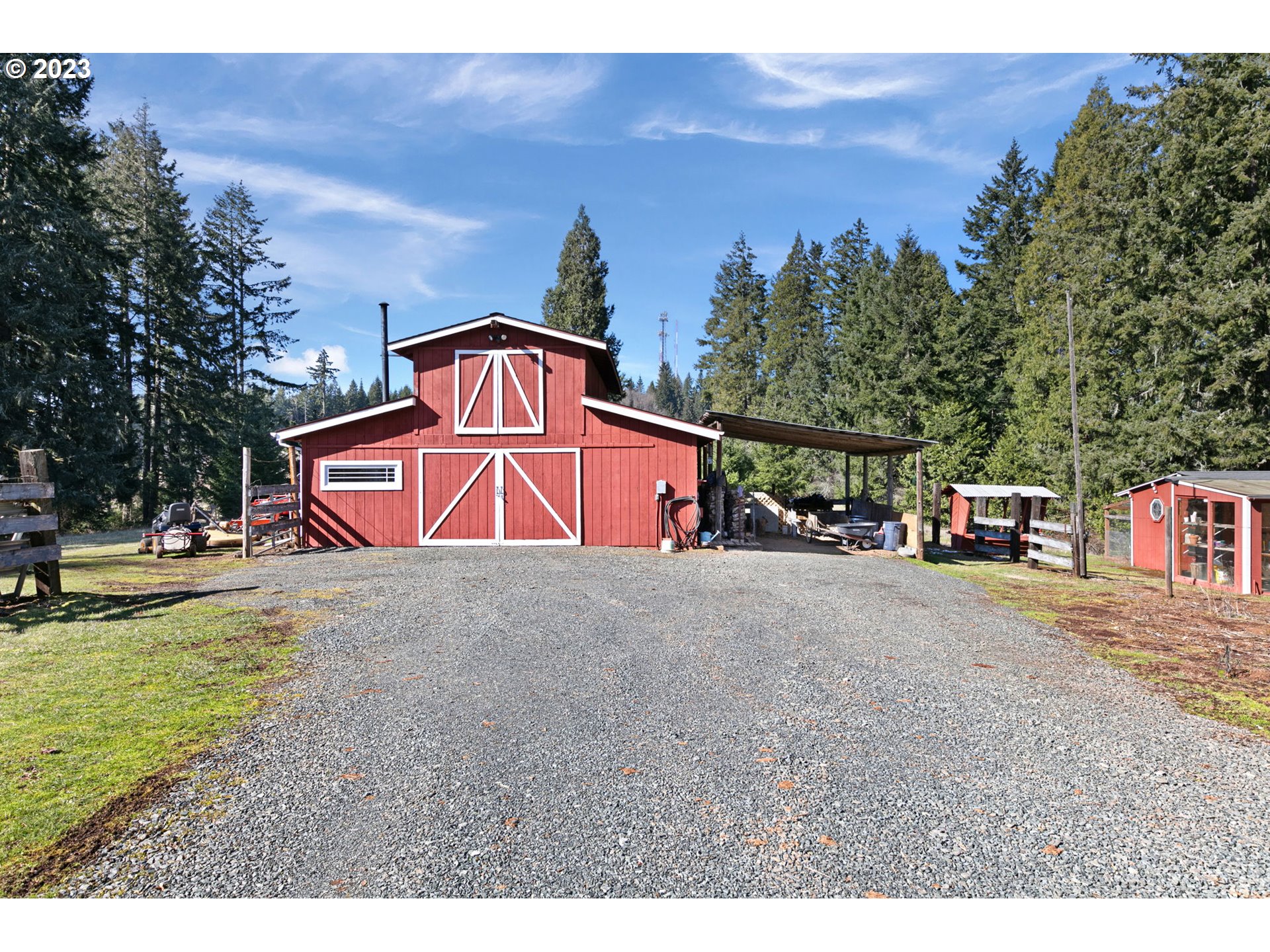 77914 Chisholm Trail Road Cottage Grove, OR 97424 - Photo 27 of 41 a view of a house with a yard