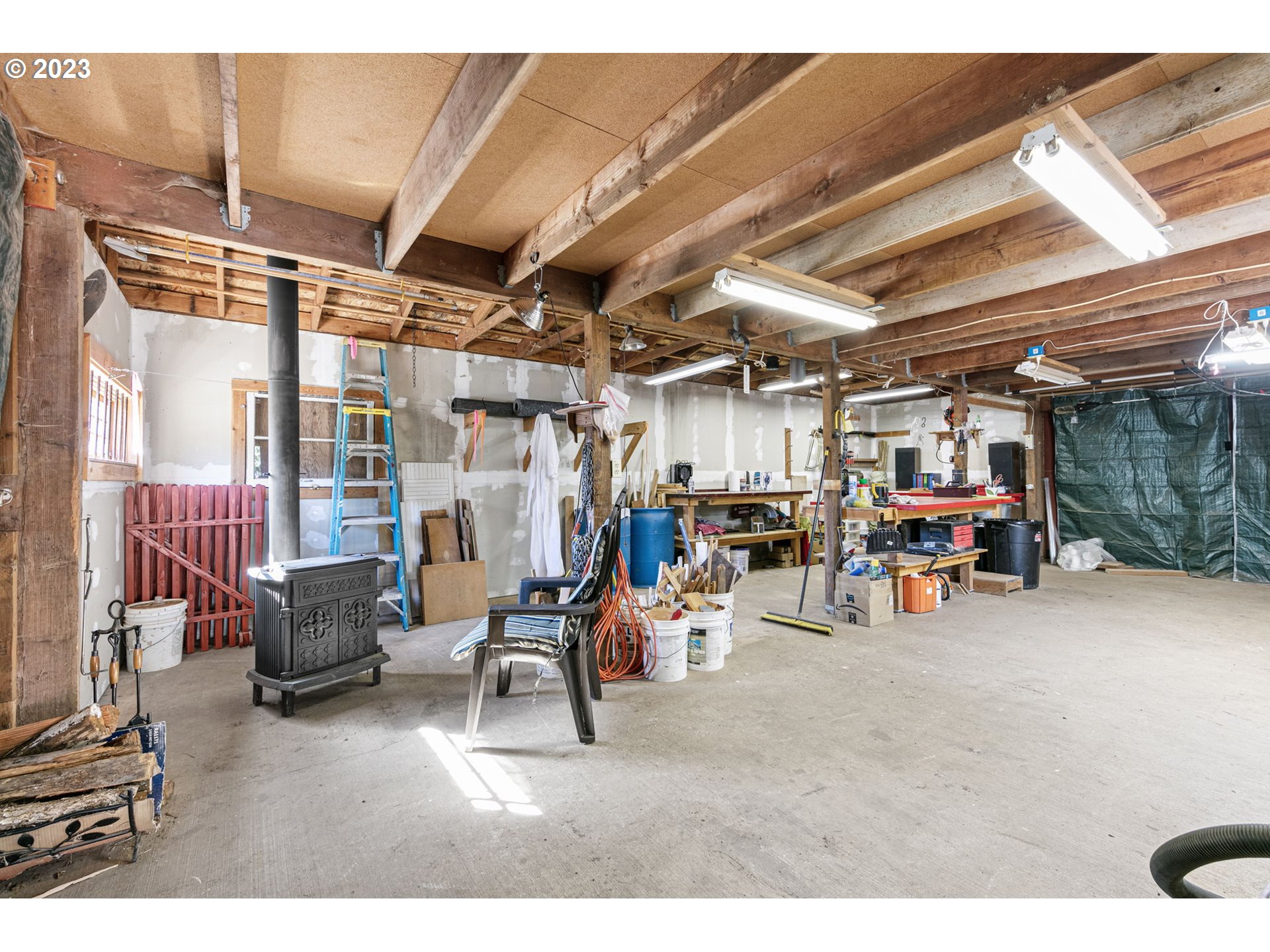 77914 Chisholm Trail Road Cottage Grove, OR 97424 - Photo 28 of 41 a view of a garage with lots of stuff