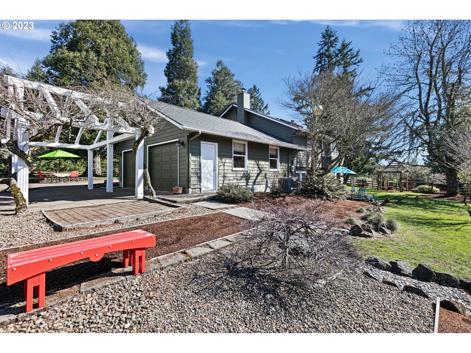 77914 Chisholm Trail Road Cottage Grove, OR 97424 - Photo 5 of 41 a backyard of a house with yard and outdoor seating