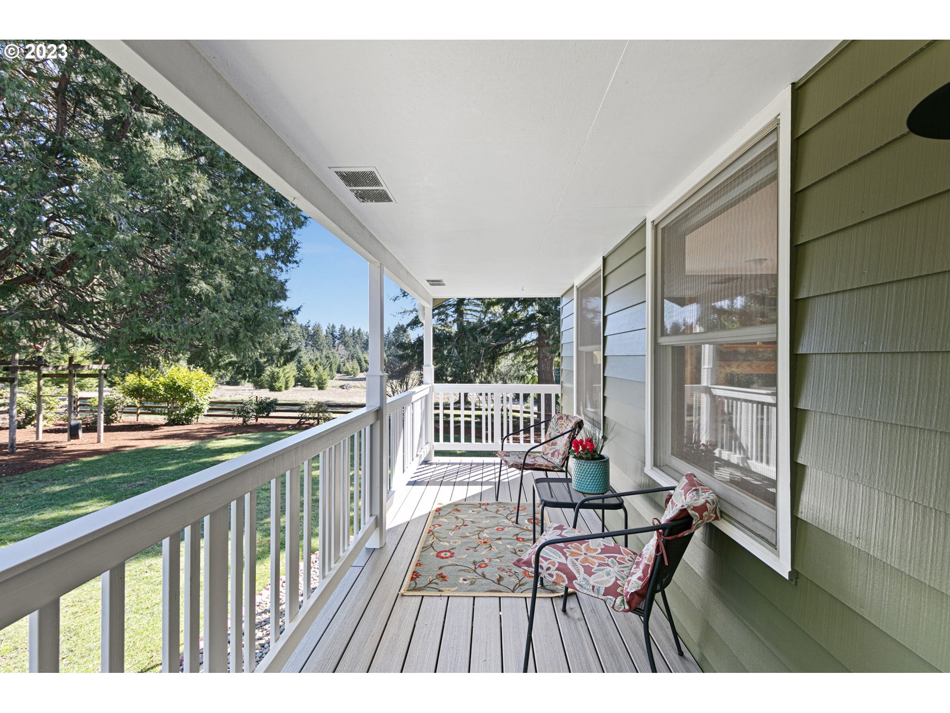 77914 Chisholm Trail Road Cottage Grove, OR 97424 - Photo 6 of 41 a balcony with wooden floor outdoor seating and wooden floor
