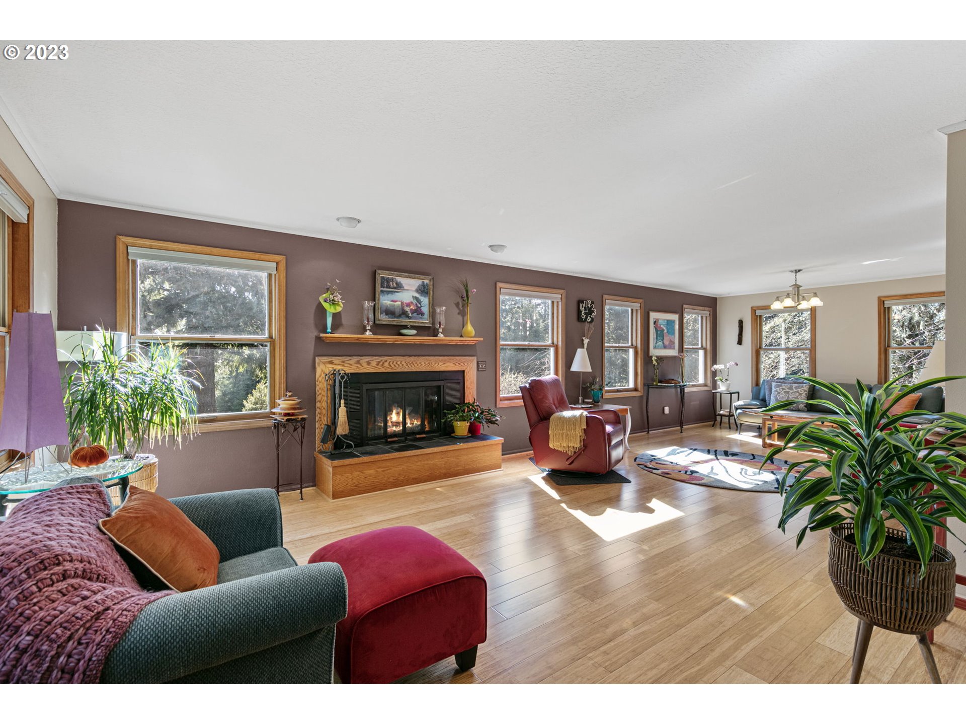 77914 Chisholm Trail Road Cottage Grove, OR 97424 - Photo 8 of 41 a living room with furniture large window and a fireplace