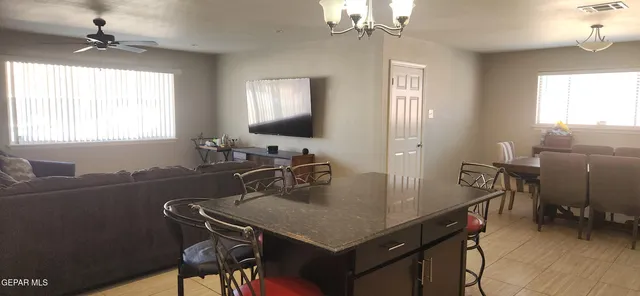 a view of a dining room with furniture and window