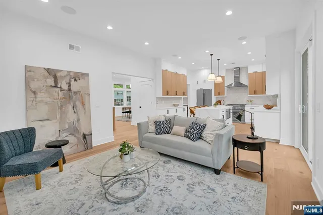 a living room with furniture white walls and white walls
