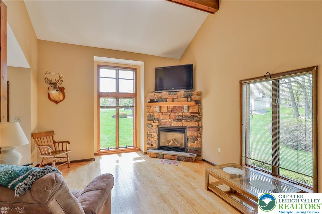 1208 Rone Drive Wind Gap, PA 18091 - Photo 16 of 78 a living room with furniture large window and flat screen tv