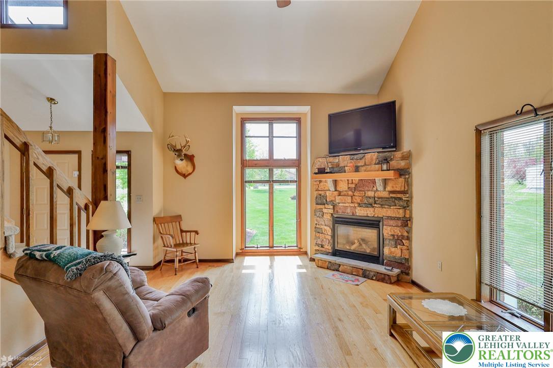 1208 Rone Drive Wind Gap, PA 18091 - Photo 17 of 78 a living room with furniture and a flat screen tv