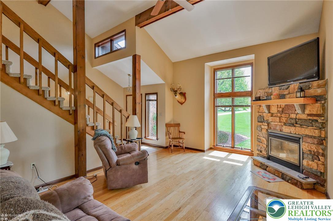 1208 Rone Drive Wind Gap, PA 18091 - Photo 18 of 78 a living room with fireplace furniture and a flat screen tv