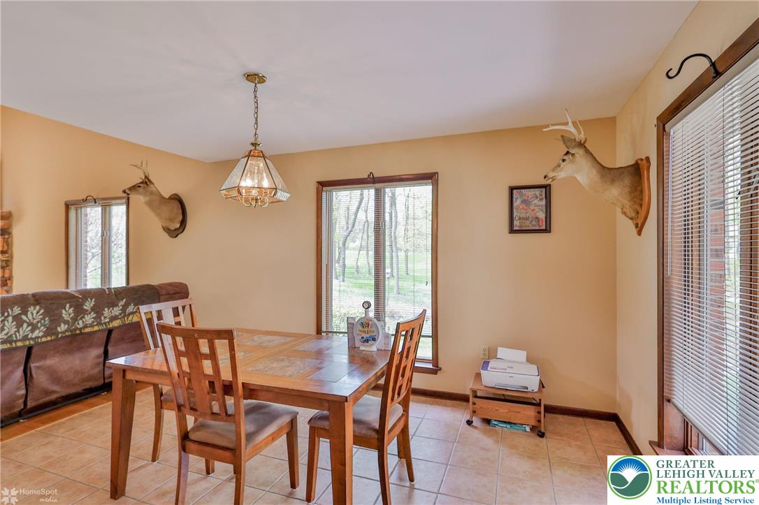 1208 Rone Drive Wind Gap, PA 18091 - Photo 21 of 78 a view of a dining room with furniture and a chandelier