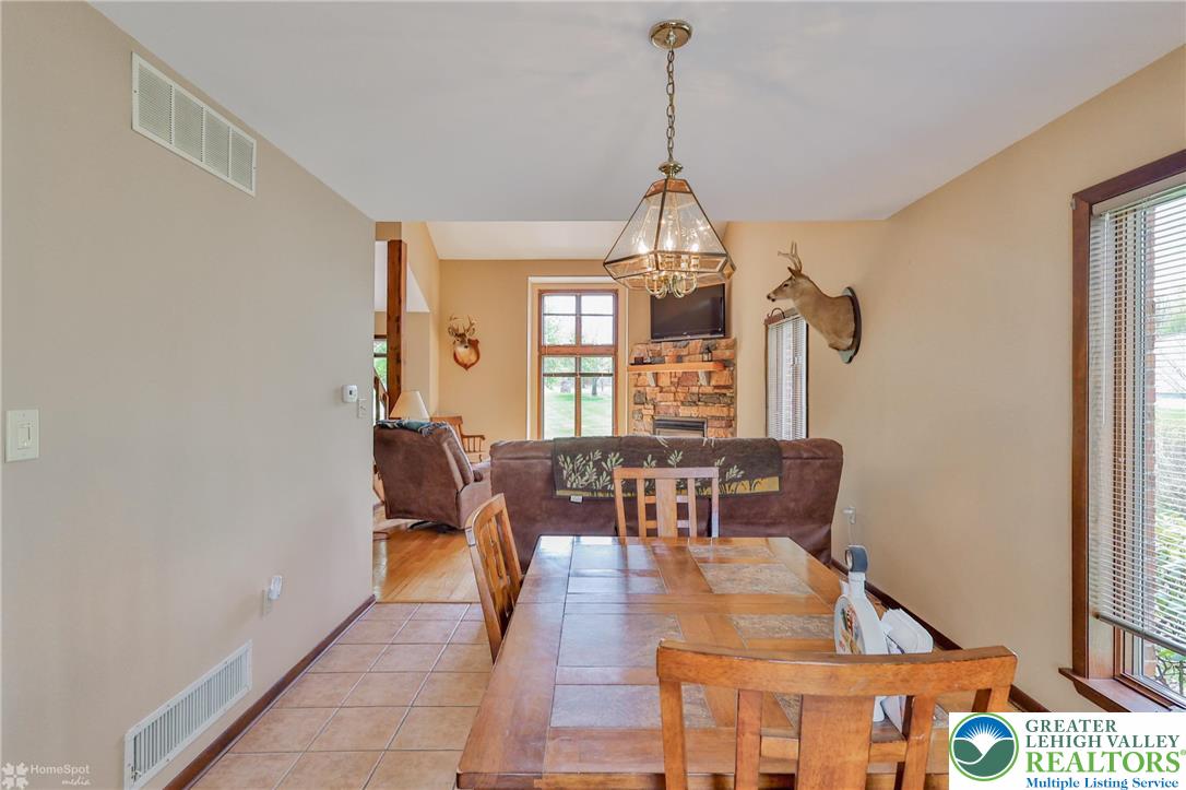 1208 Rone Drive Wind Gap, PA 18091 - Photo 23 of 78 a view of a dining room with furniture window and wooden floor