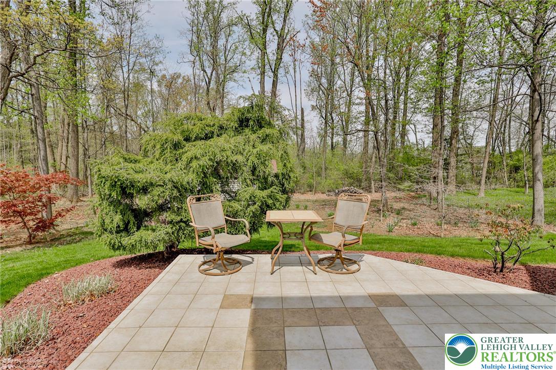 1208 Rone Drive Wind Gap, PA 18091 - Photo 29 of 78 a view of a patio with table and chairs and potted plants