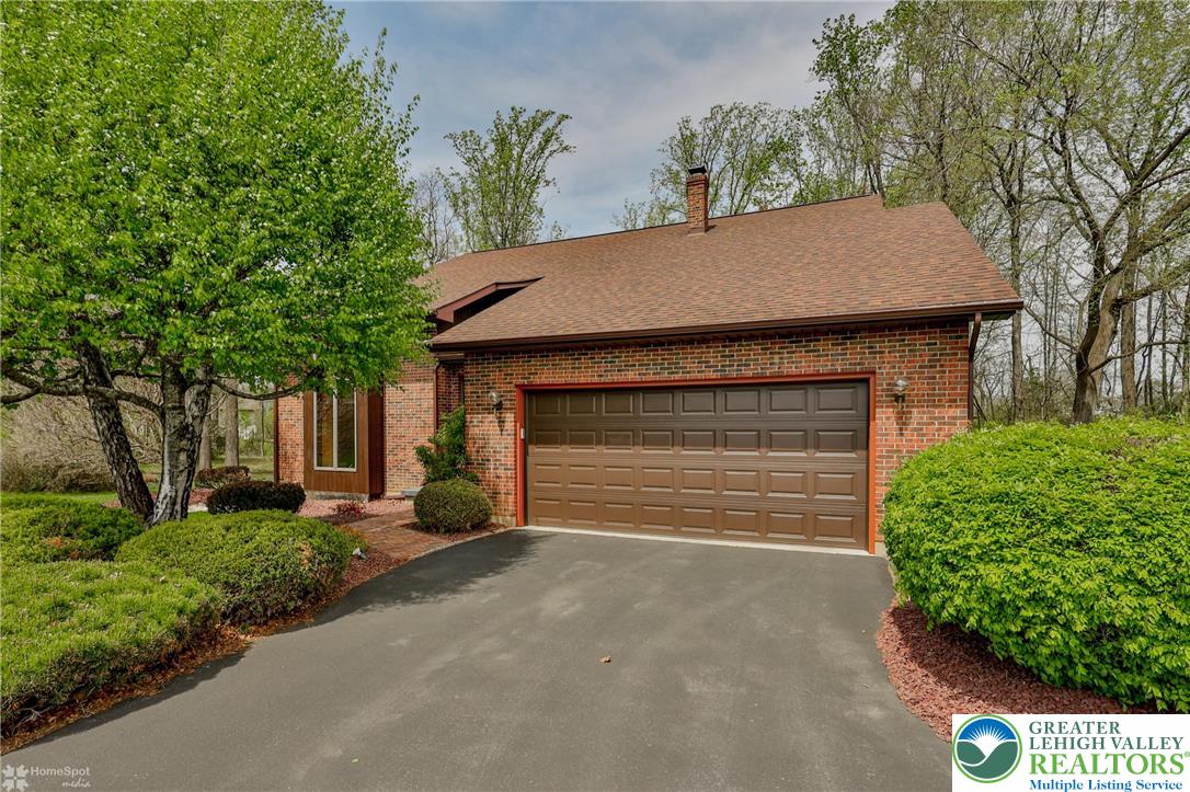 1208 Rone Drive Wind Gap, PA 18091 - Photo 3 of 78 a front view of a house with a yard and garage