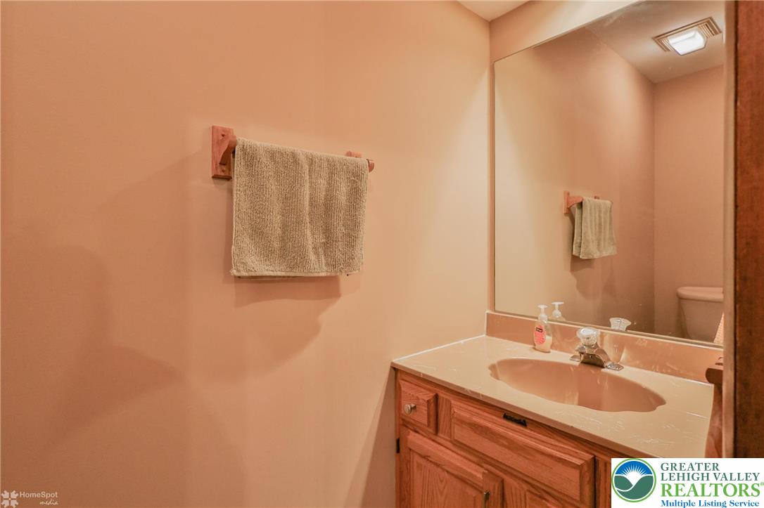 1208 Rone Drive Wind Gap, PA 18091 - Photo 31 of 78 a bathroom with a sink and a mirror