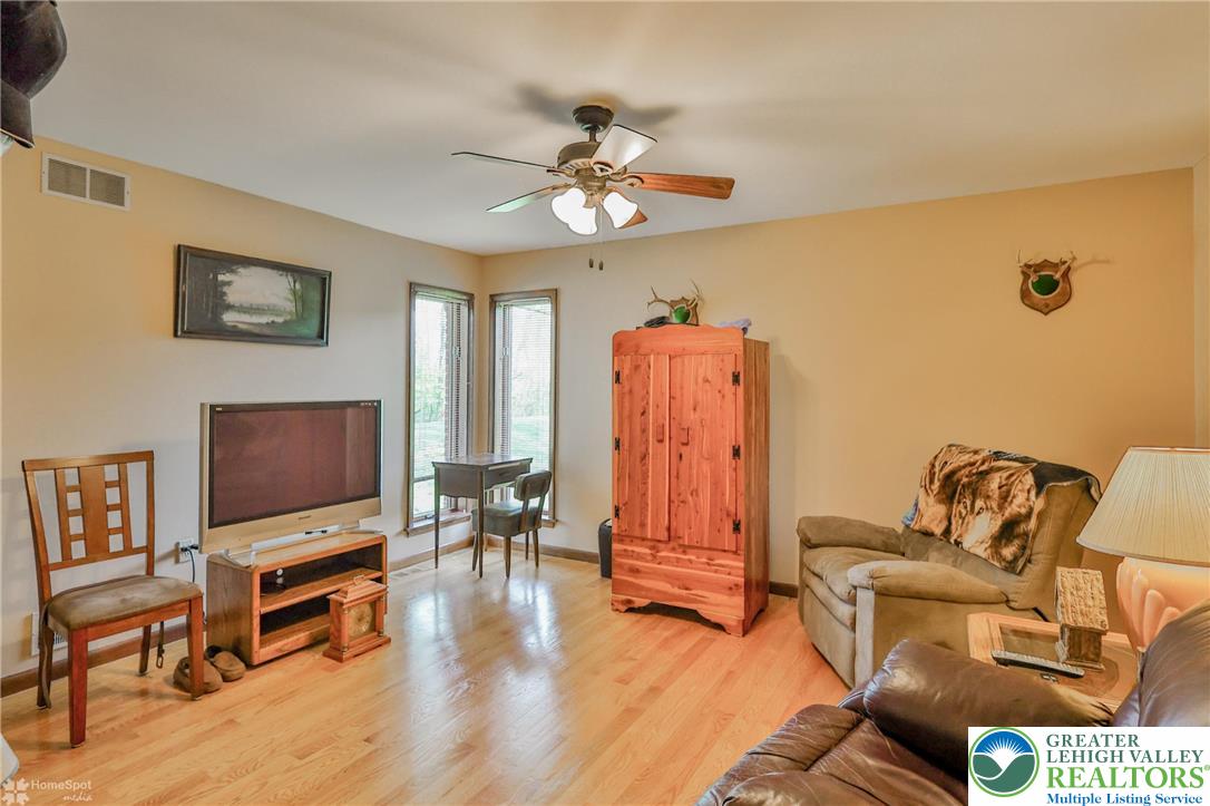 1208 Rone Drive Wind Gap, PA 18091 - Photo 32 of 78 a living room with furniture and a flat screen tv