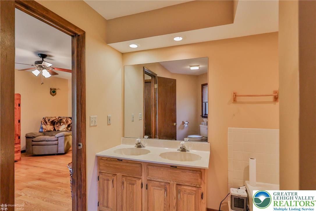 1208 Rone Drive Wind Gap, PA 18091 - Photo 39 of 78 a en suite bathroom with a sink and a mirror