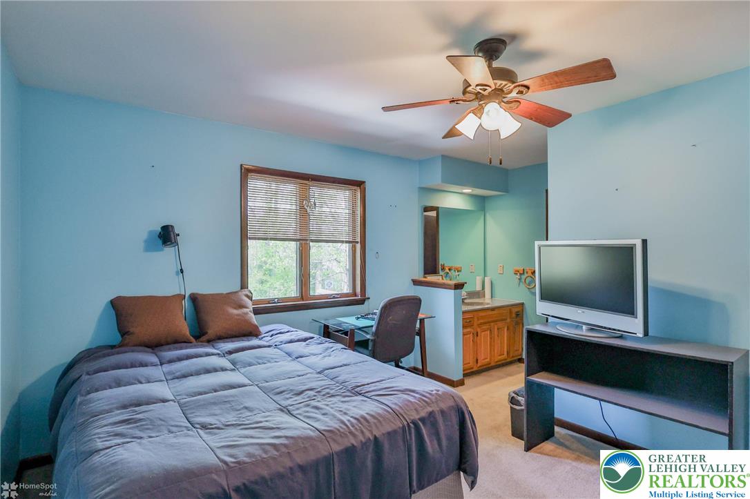 1208 Rone Drive Wind Gap, PA 18091 - Photo 43 of 78 a bedroom with a bed and a flat screen tv