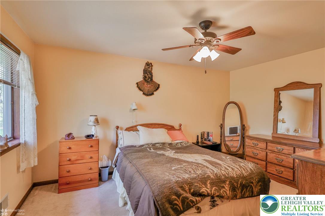 1208 Rone Drive Wind Gap, PA 18091 - Photo 53 of 78 a bedroom with a bed and wooden floor