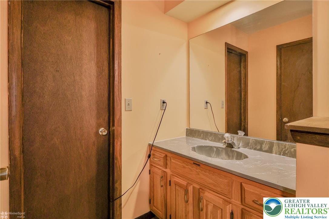 1208 Rone Drive Wind Gap, PA 18091 - Photo 55 of 78 a bathroom with a sink and a mirror