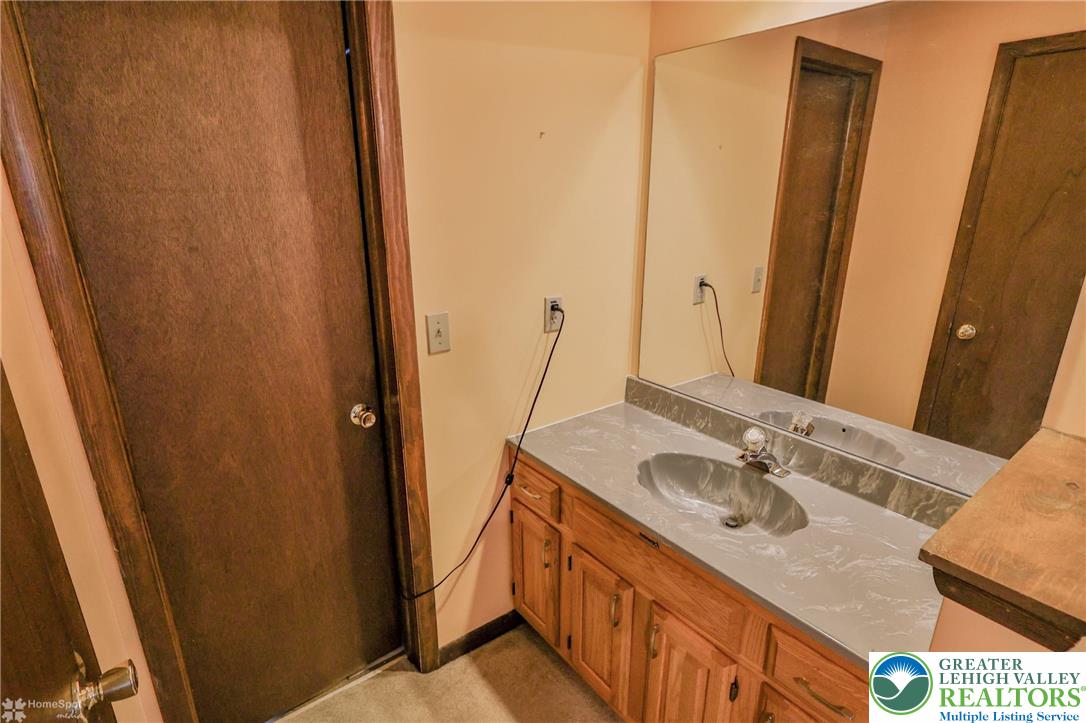 1208 Rone Drive Wind Gap, PA 18091 - Photo 56 of 78 a bathroom with sink and mirror