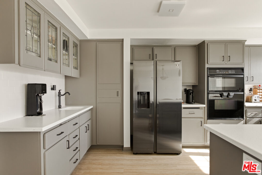 2845 Harbor Boulevard Oxnard, CA 93035 - Photo 14 of 47 a kitchen with a refrigerator and a sink