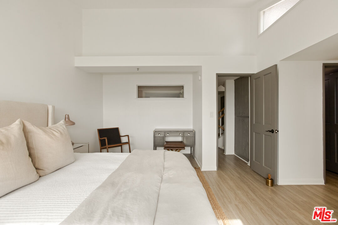 2845 Harbor Boulevard Oxnard, CA 93035 - Photo 18 of 47 a bedroom with a bed and wooden floor