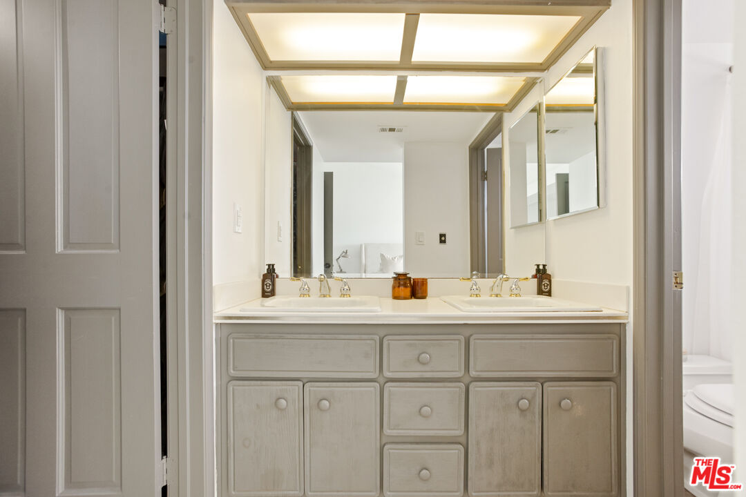 2845 Harbor Boulevard Oxnard, CA 93035 - Photo 19 of 47 a bathroom with a sink and a mirror