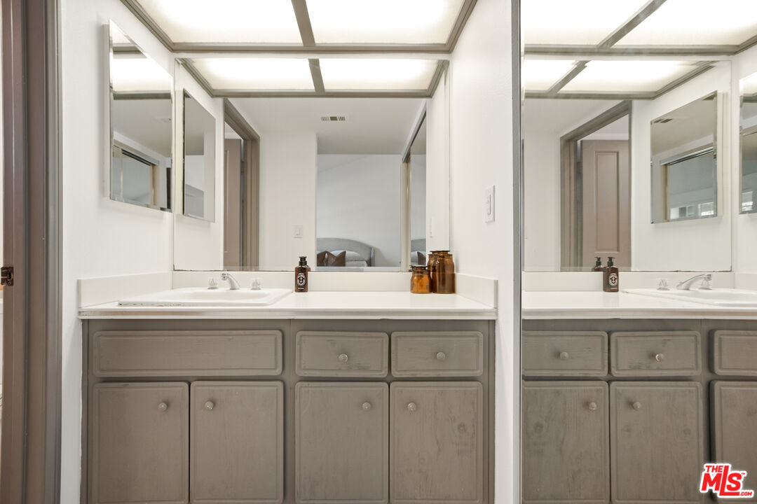 2845 Harbor Boulevard Oxnard, CA 93035 - Photo 25 of 47 a bathroom with a sink and a mirror