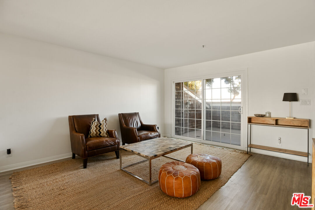2845 Harbor Boulevard Oxnard, CA 93035 - Photo 7 of 47 a living room with furniture and wooden floor