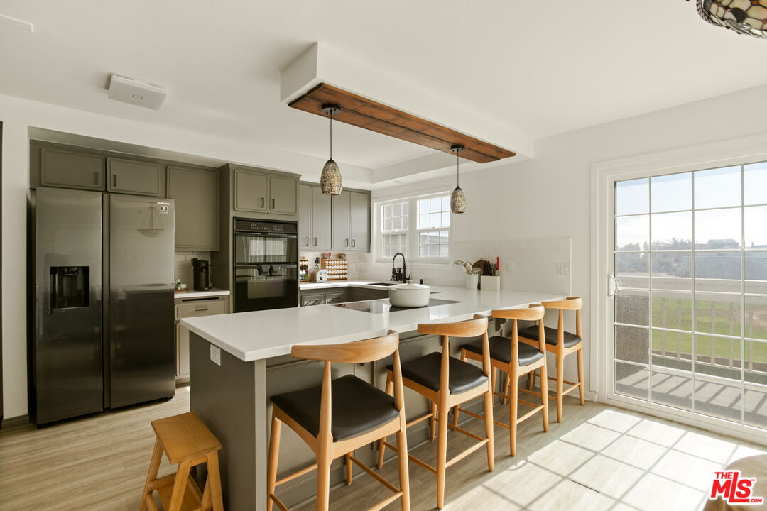 2845 Harbor Boulevard Oxnard, CA 93035 - Photo 10 of 47 a large kitchen with a table and chairs