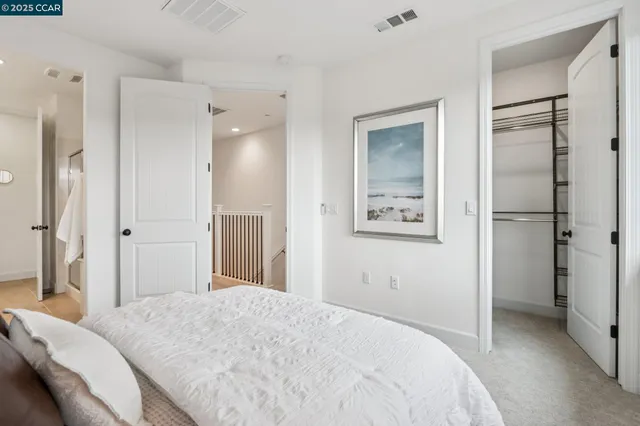 a bedroom with a bed and closet