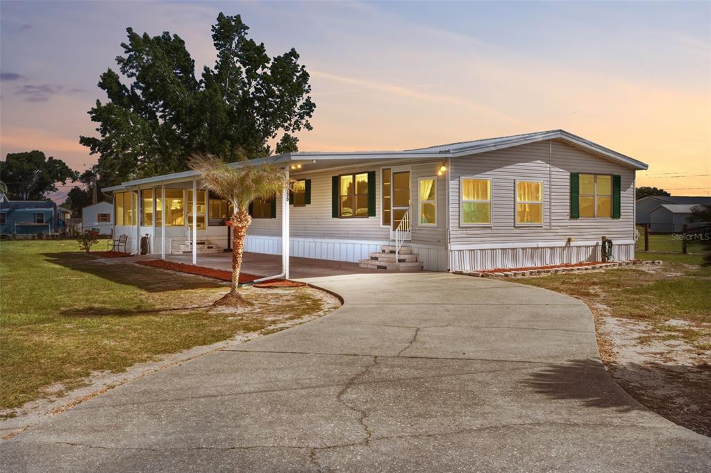 1586 Grapefruit Street Arcadia, FL 34266 - Photo 1 of 40 a front view of a house with a yard and garage