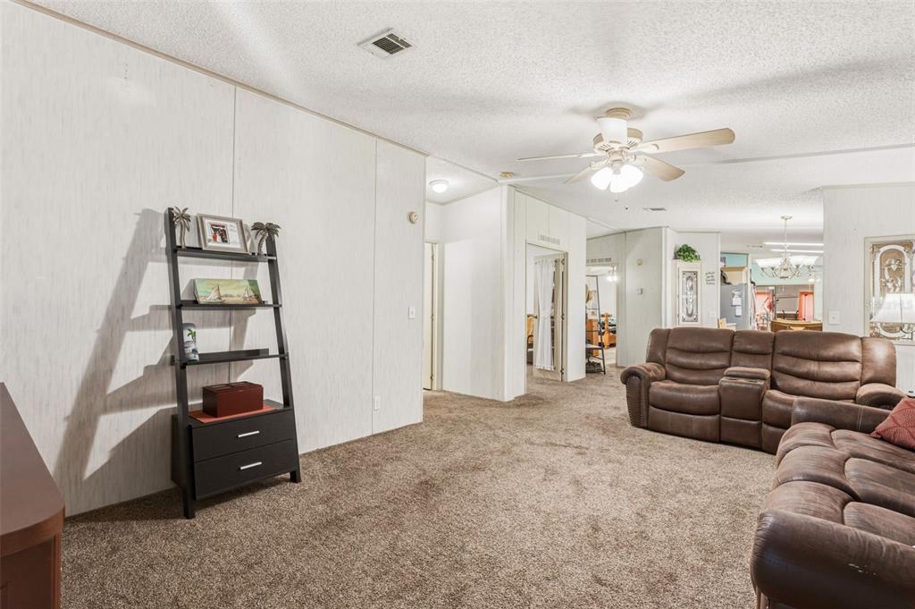 1586 Grapefruit Street Arcadia, FL 34266 - Photo 11 of 40 a living room with furniture and wooden floor